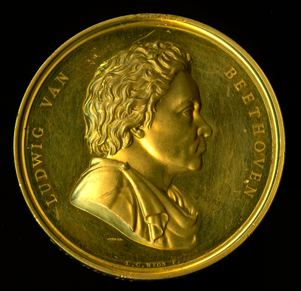 Medal:  Beethoven medal. The Royal Philharmonic Society Gold Medal presented to Sir Henry Wood, 1921. Designed by Leonard Charles Wyon.